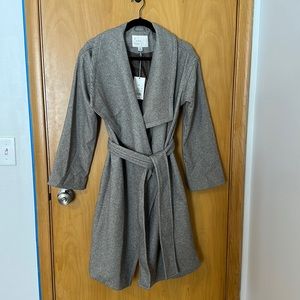 Neutral brown trench coat. Never been worn. Size XS.